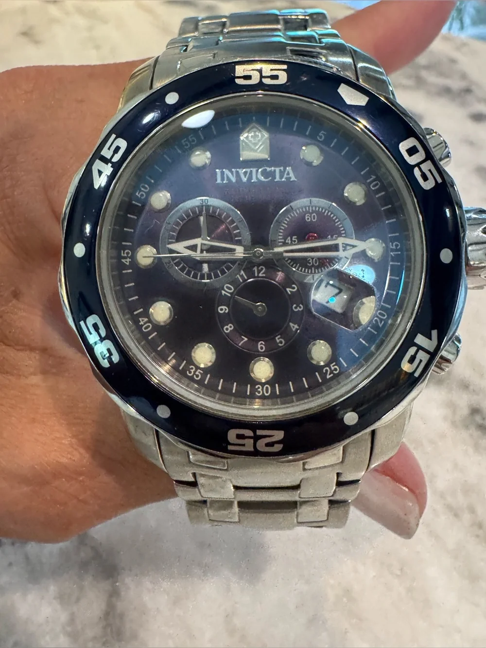 Invicta Silver Stainless Steel Watch with Black Bezel and Dark Dial